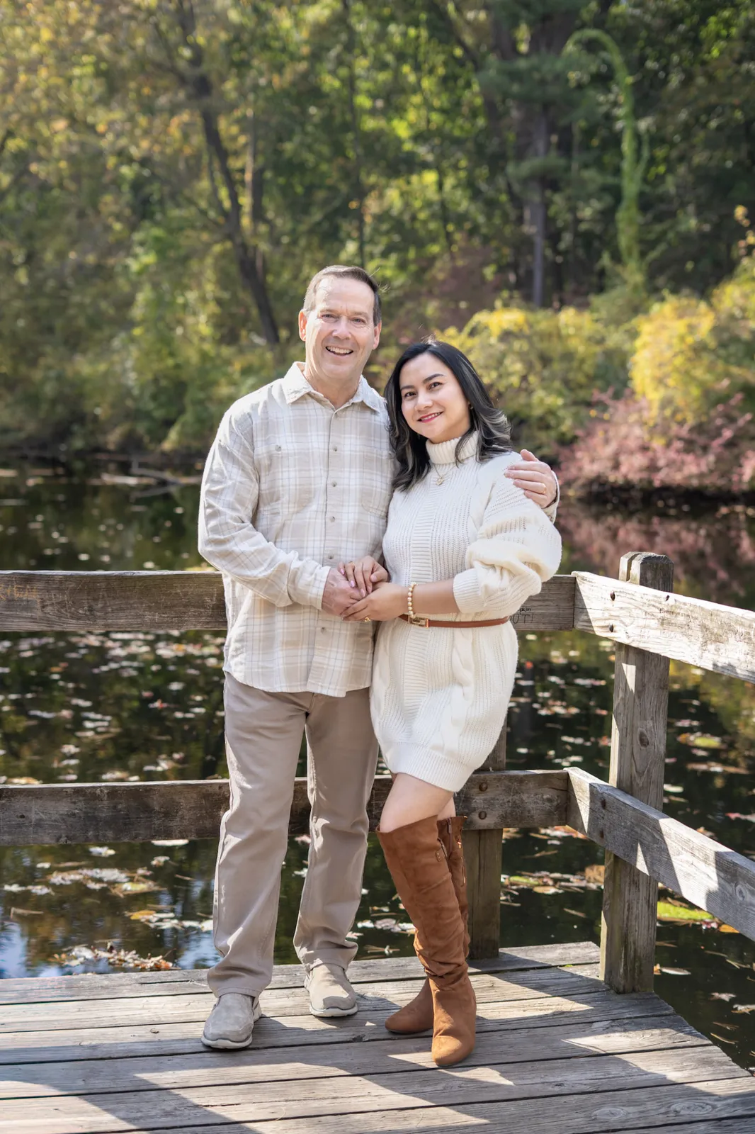 Belle Fall Pictorials couple portrait on a dock with fall scenery