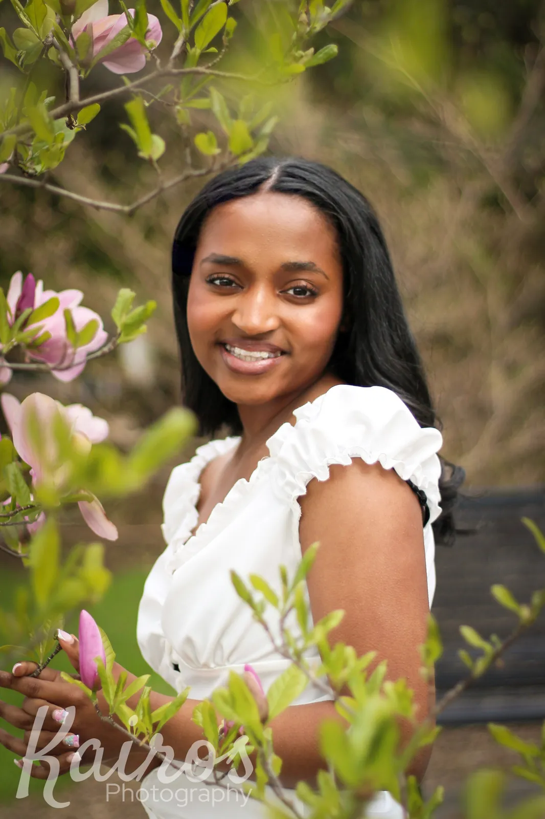 Camryn senior portrait against brick wall