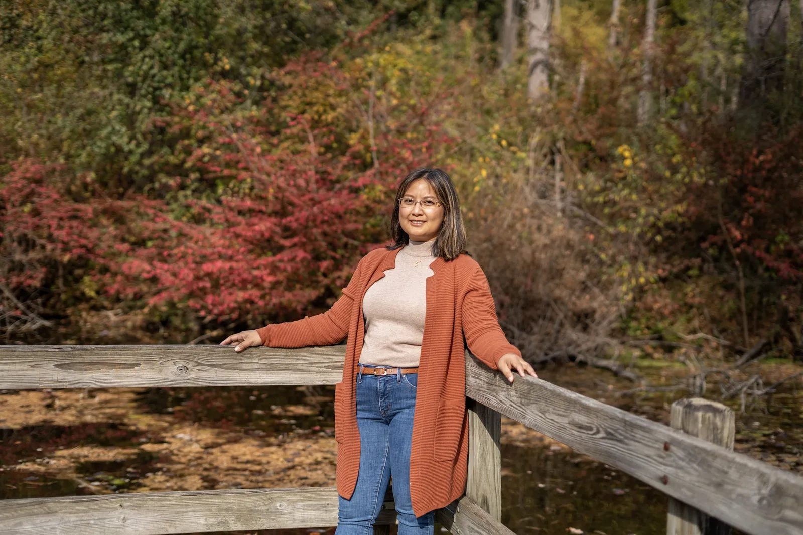 Grace Fall Pictorials solo portrait on dock with fall color