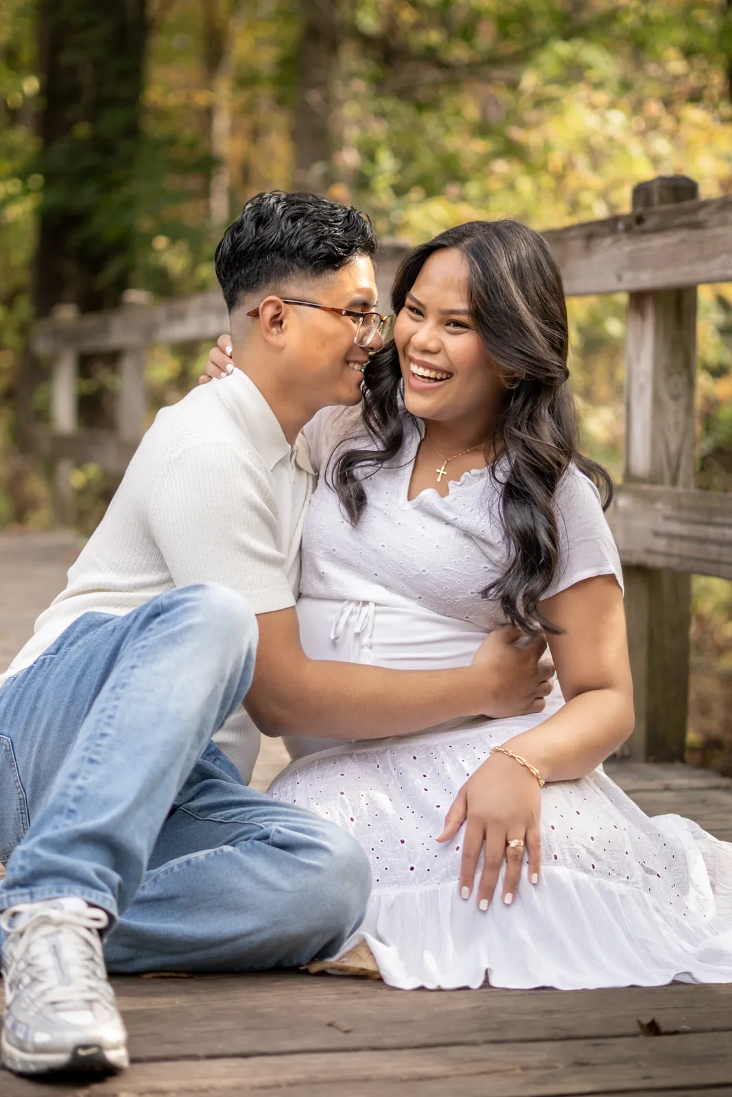 Marianne Fall Pictorials close portrait of expecting parents laughing