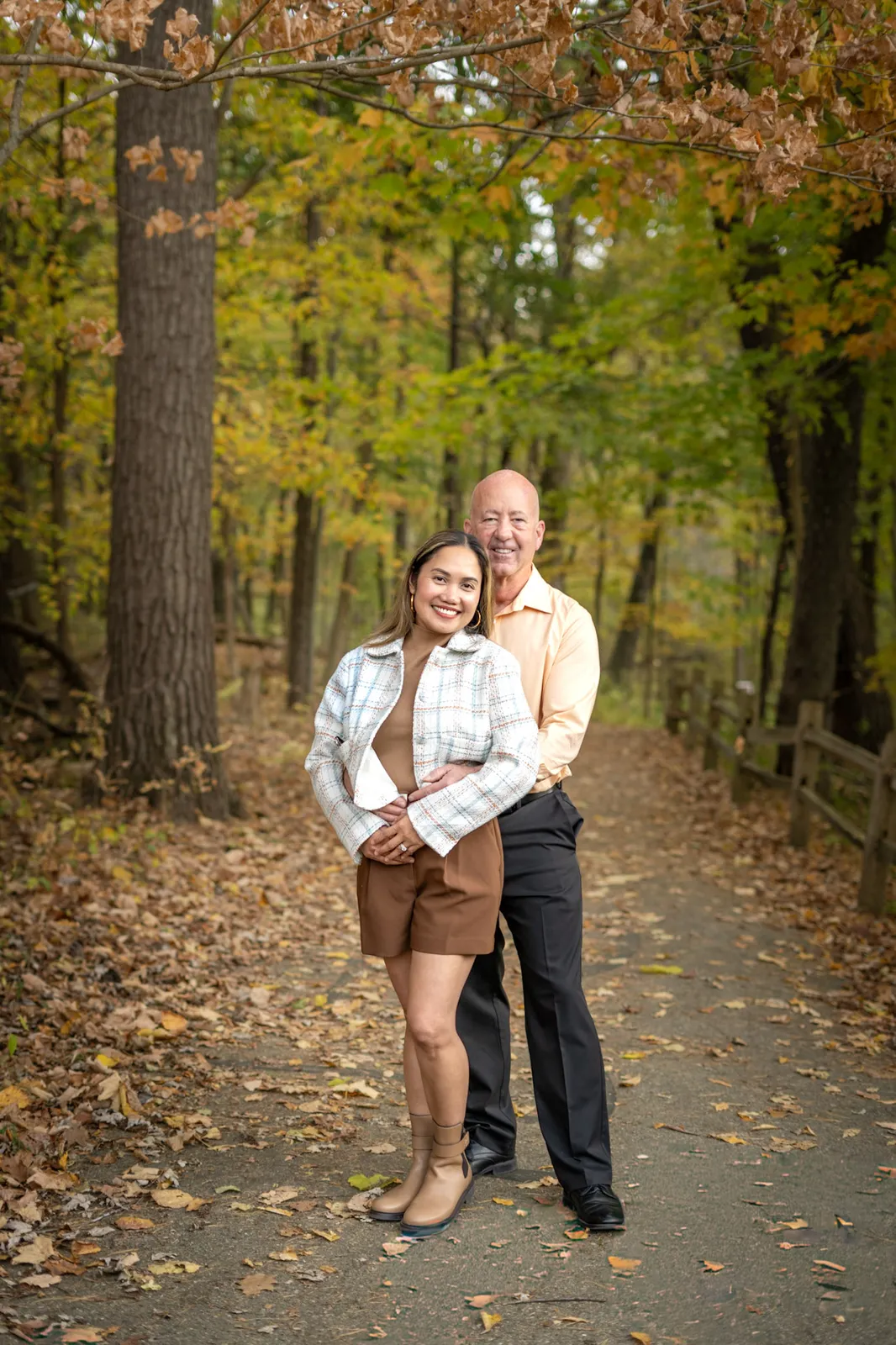 Richelle Fall Pictorials romantic couple embrace on wooded path